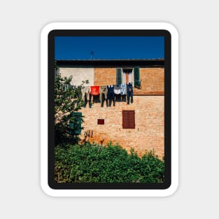 Laundry Drying on Washing Line Against Old Brick Building in Tuscany Italy Magnet