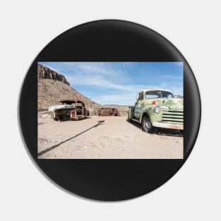 Old abandoned trucks and cars in Arizona desert Pin