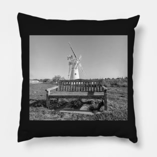 Wooden bench and traditional windmill on the riverbank Pillow