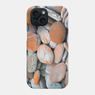 Beach stones in grey with orange coloured lichen Phone Case