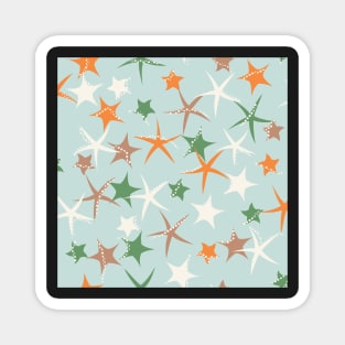 Starfish galaxy in sage green, zesty orange, off white and caramel. Magnet