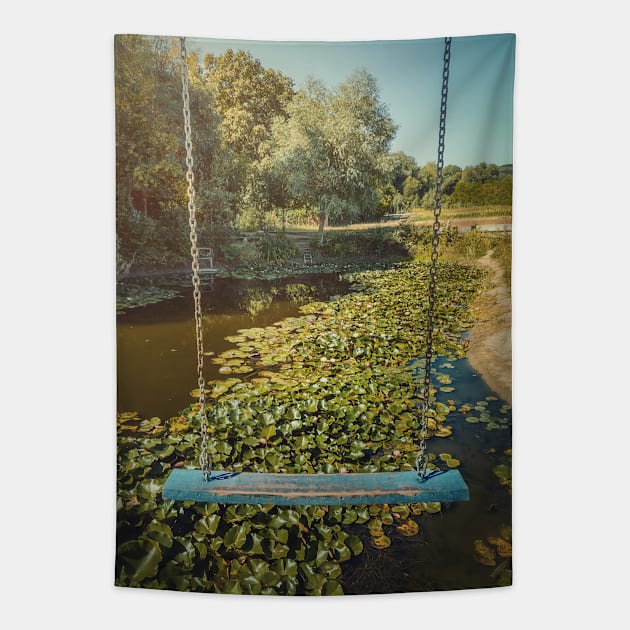 swing hanging over a waterlilies pond Tapestry by psychoshadow