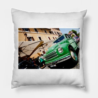 Green classic Fiat truck parked in Italian Street. Pillow