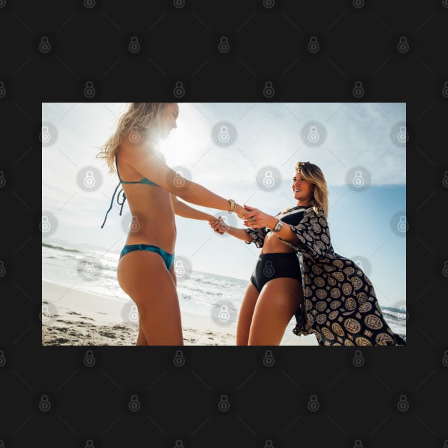 Two Young Pretty Girls Having Fun Together on Sunny Beach by visualspectrum