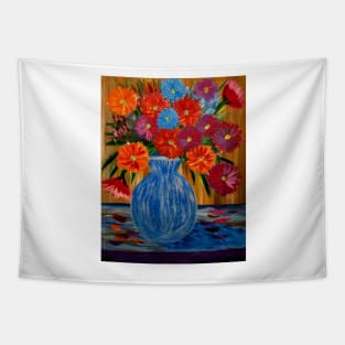 A lovely boutique of abstract mixed flowers  in a  tall a glass vase Tapestry