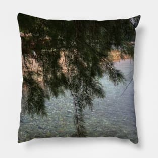 Stone sea surface in pristine clear water under a fir tree Pillow