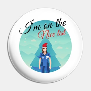 I'm on Santa's nice list - funny festive Nurse design with nurse in scrubs and Santa hat in front of a Christmas tree Pin