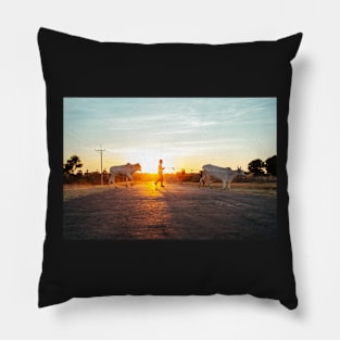 Silhouette of Boy Leading Cattle Across Road at Sunset in Burmese Countryside Pillow