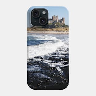 Waves coming ashore near Bamburgh Castle, Northumberland, UK Phone Case