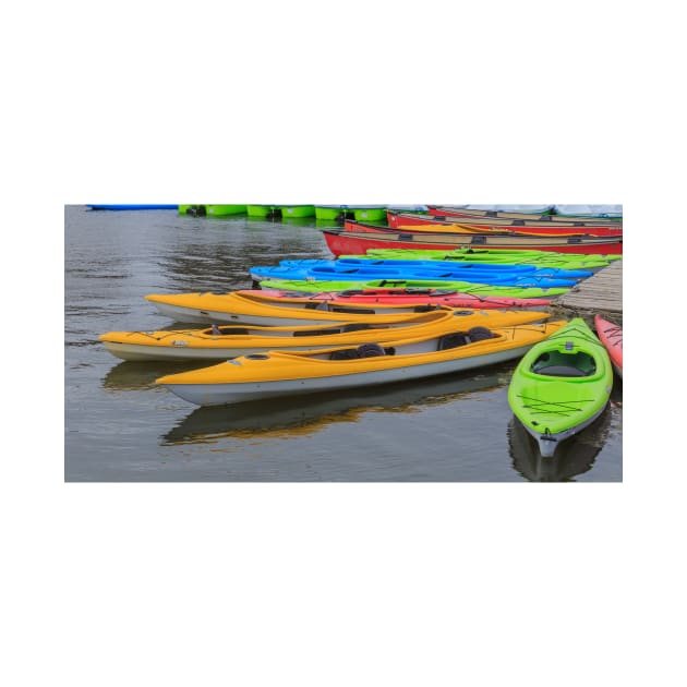 Tied up Kayaks on water by josefpittner