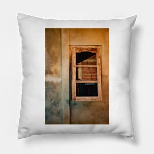 Wooden window on yellow brown grained plastered wall. Pillow