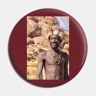 Namibia. Damara Living Museum. Portrait of a Smiling Man in the Fur Hat. Pin