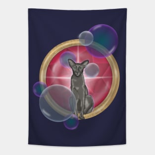 Oriental cat with soap bubbles on the background of a large red ruby Tapestry