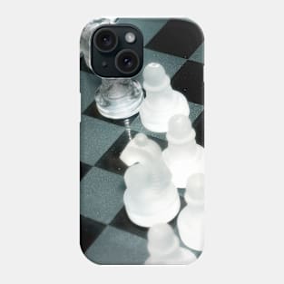 The next move - Glass chess pieces on a chess board Phone Case