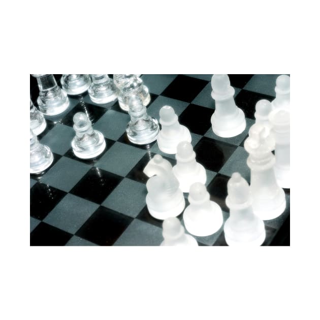 The next move - Glass chess pieces on a chess board by richflintphoto