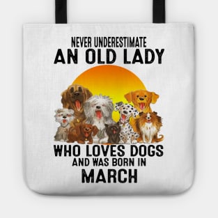 Never Underestimate An Old March Lady Who Loves Dogs Tote