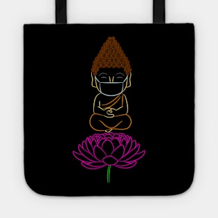 Adorable Buddha wearing a protective mask against Coronavirus while meditating on a Lotus flower Tote