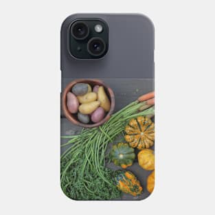 Top down view of multicolored carrots, fingerling Potatoes and Pumpkins in Autumn season Phone Case