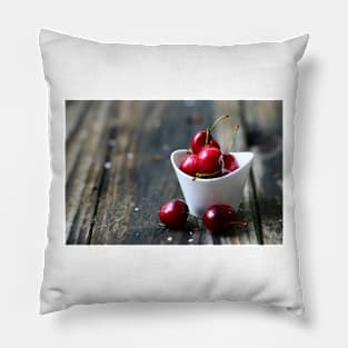 Cherries in a white bowl. Pillow