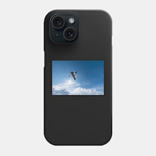 Snowboarder jumping against blue sky Phone Case