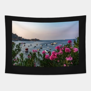 Pink Nerium oleander flowers with Malta Bay in the background Tapestry