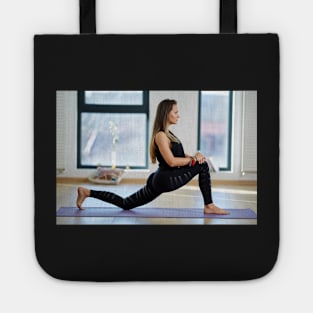 Woman in various yoga postures Tote