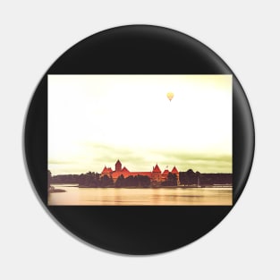 Yellow air balloon over red Castle Pin