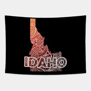 Colorful mandala art map of Idaho with text in brown and orange Tapestry