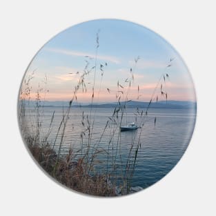 Serene Ocean Sunset: Boat Amidst Weeds Pin