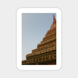 Second unusual low angle view of a Buddha stupa against clear sky. Magnet