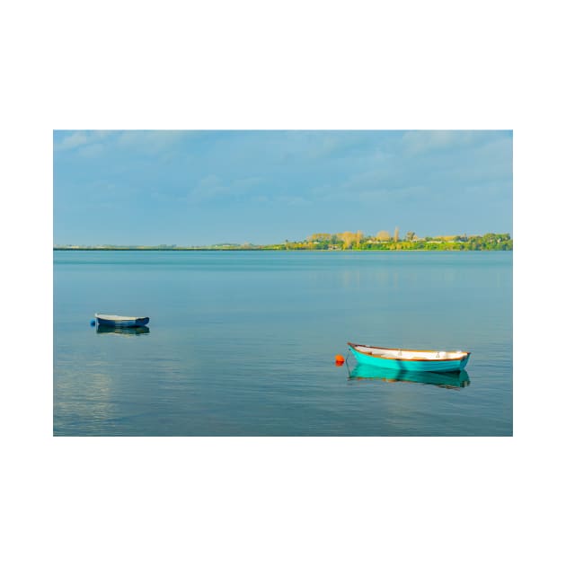 Catching the late sun - Two dinghies floating idly on calm harbour water at Tauranga New Zealand by brians101