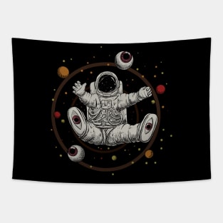 Sitting and Floating Astronout with lots of eyes in the circular loops Tapestry