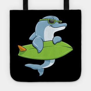 Dolphin with sunglasses as surfer with surfboard Tote