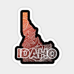 Colorful mandala art map of Idaho with text in brown and orange Magnet