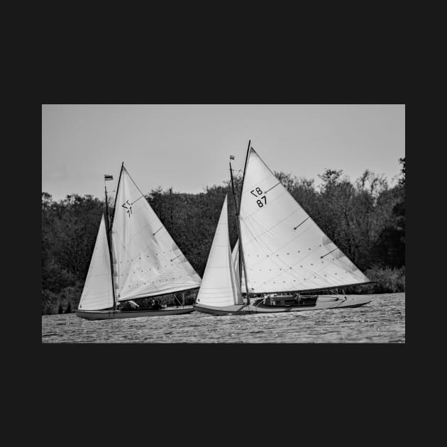 Two traditional brown boats racing on Wroxham Broad, Norfolk by yackers1