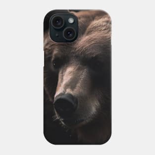 A brown bear in nature that looks cute and cuddly looks warm. ส่ง Phone Case