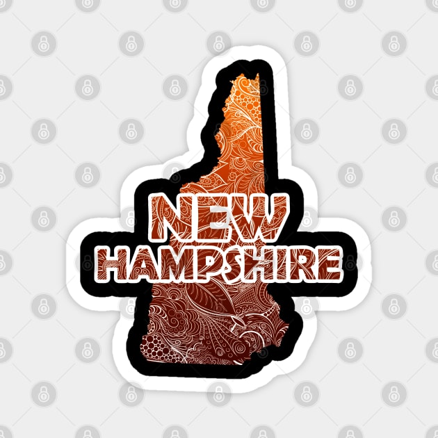 Colorful mandala art map of New Hampshire with text in brown and orange Magnet by Happy Citizen