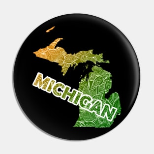 Colorful mandala art map of Michigan with text in green and orange Pin