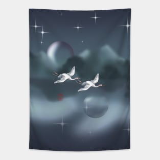 Two Japanese cranes flying over a dark lake Tapestry