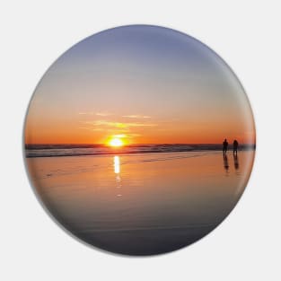 Silhouetted couple enjoys sunset at beach Pin