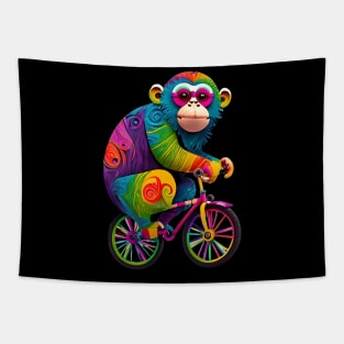 Rainbow colored monkey on a bicycle Tapestry
