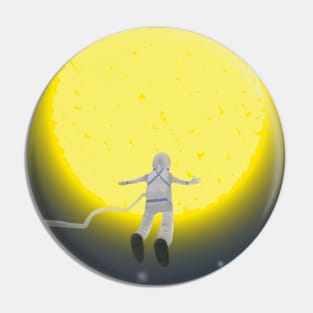 Astronaut in space against the background of the sun. Pin