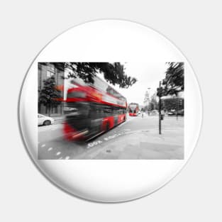 Red double-decker bus on the street of London Pin