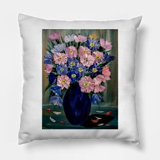 A lovely boutique of flowers in a blue vase . Pillow