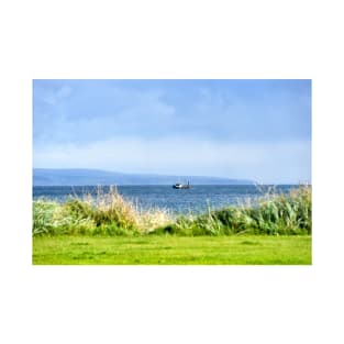 Fishing boat moving along the coast at Peninver, Scotland T-Shirt