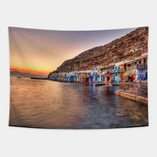 Sunset at the fishermen houses with the impressive boat shelters, also known as “syrmata” in Klima of Milos, Greece Tapestry