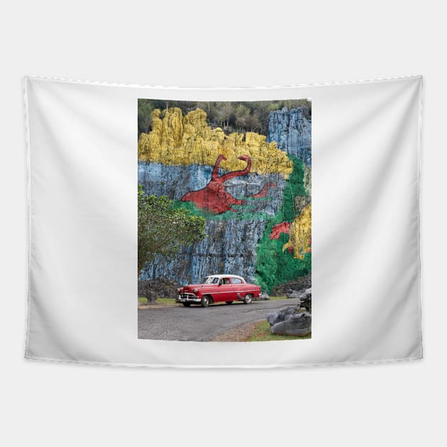 Vintage cars in front of the Mural de la Prehistoria in Cuba Tapestry by Offiinhoki