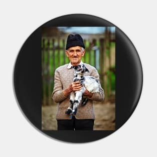 Old farmer with a baby goat Pin