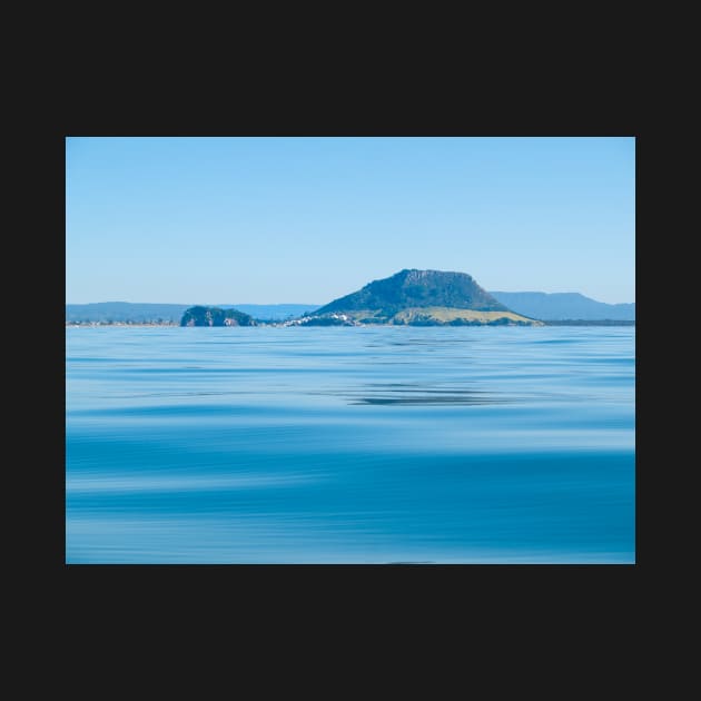 Landmark Mount Maunganui at Tauranga New Zealand and background hills across calm idyllic blue sea by brians101