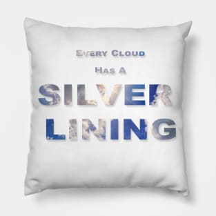 Every Cloud Has A Silver Lining text with clouds and sun burst showing through the text. Pillow